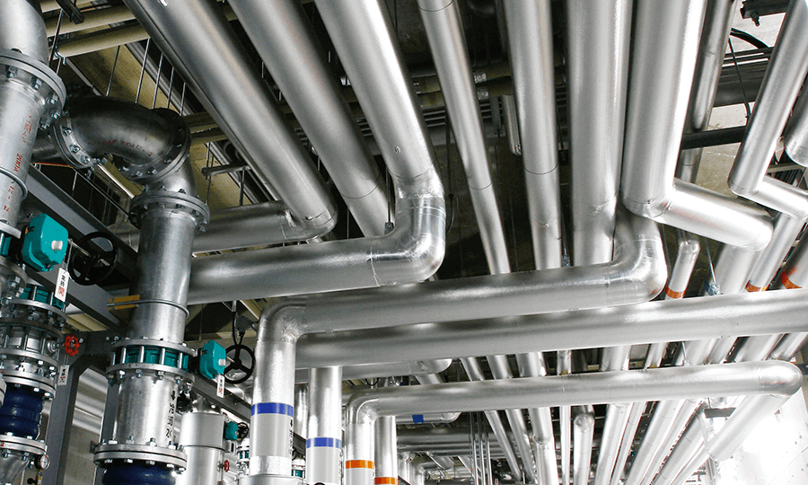 A network of metallic industrial pipes in a facility.